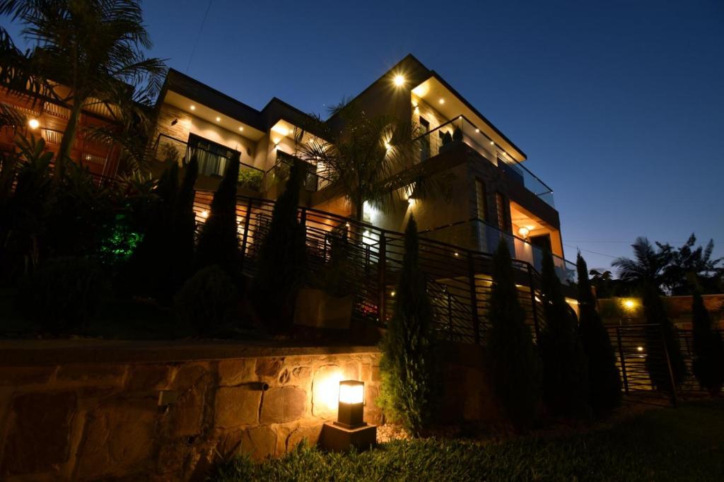 a house with a light in front of it at night at Supreme Villa in Kigali