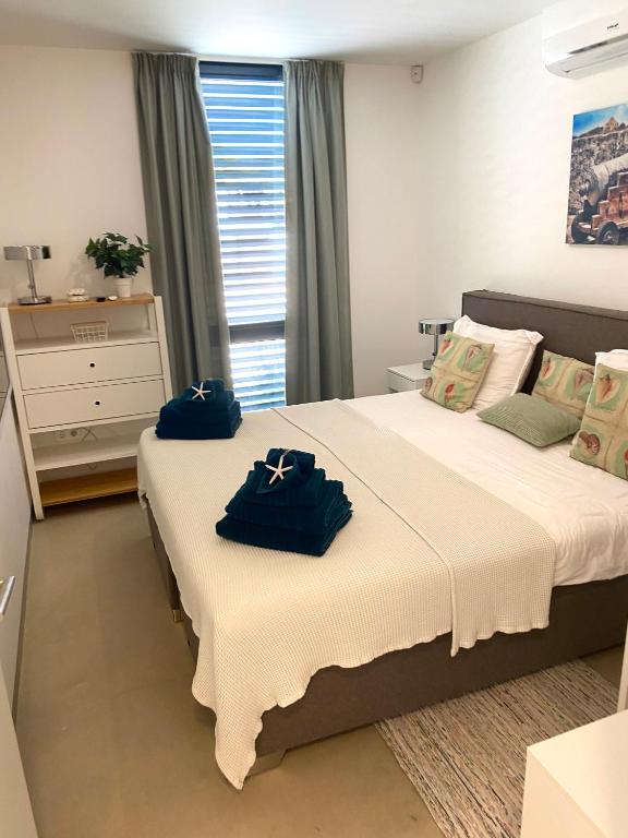 Postel nebo postele na pokoji v ubytování La Vista Luxury Apartment Jan Thiel