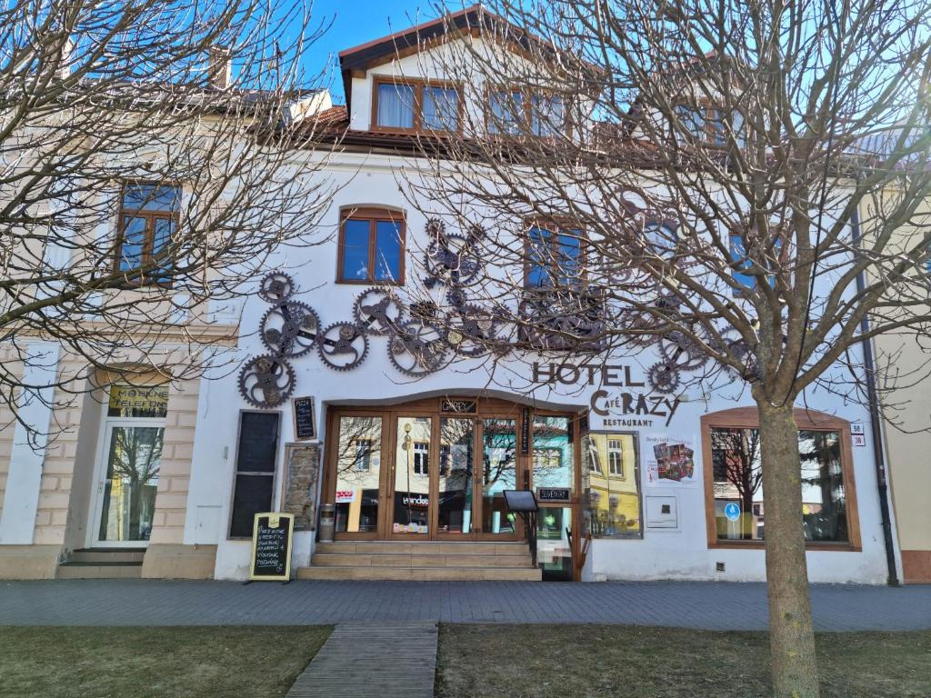 a building with a sign that reads troll city at Hostel CafeRAZY in Poprad