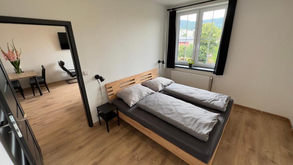 Postel nebo postele na pokoji v ubytování Apartmány Pod Stráží