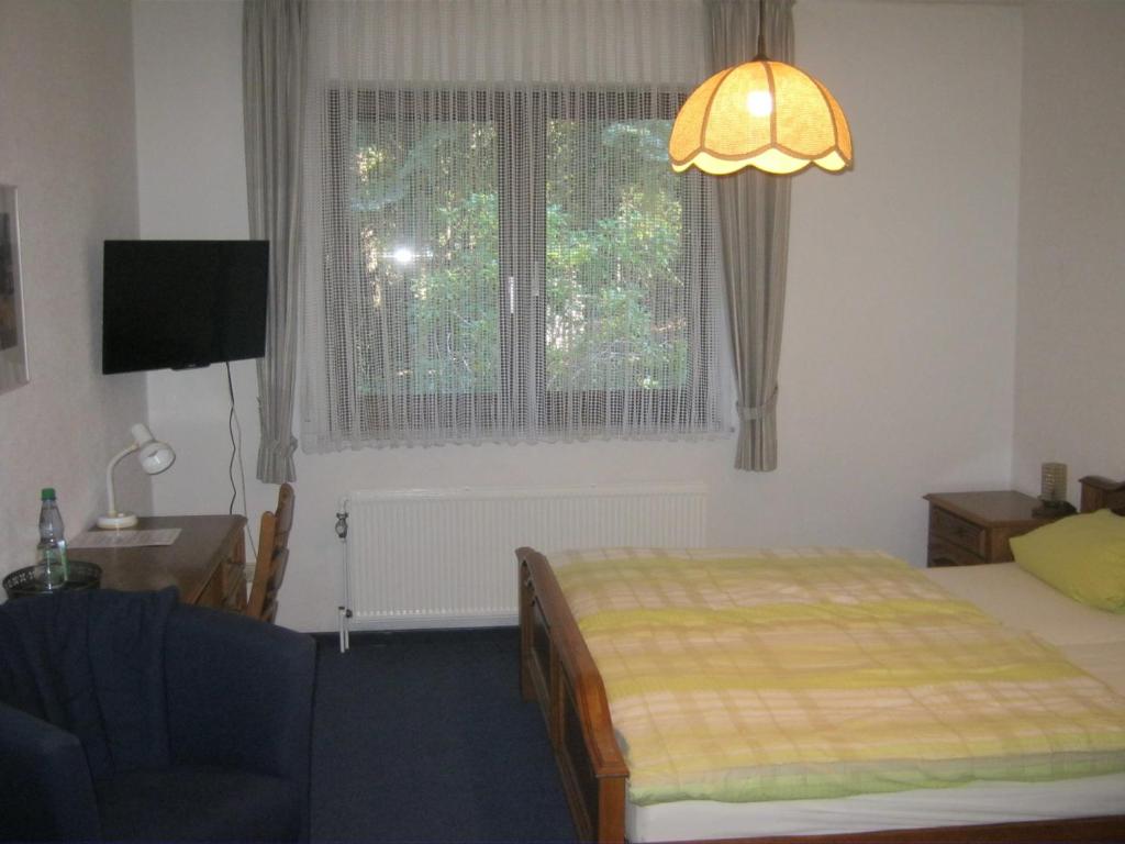 Postel nebo postele na pokoji v ubytování Hotel am Weißdornbusch
