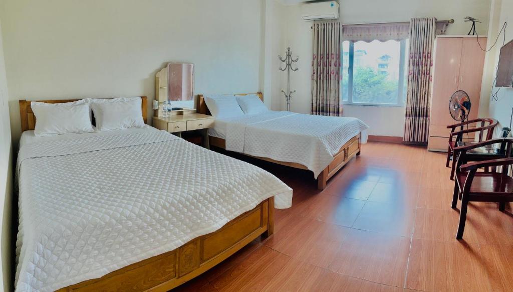 Postel nebo postele na pokoji v ubytování Van Anh Hotel