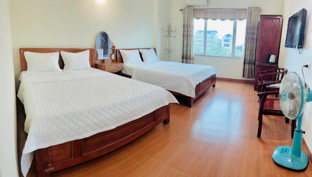 Postel nebo postele na pokoji v ubytování Van Anh Hotel