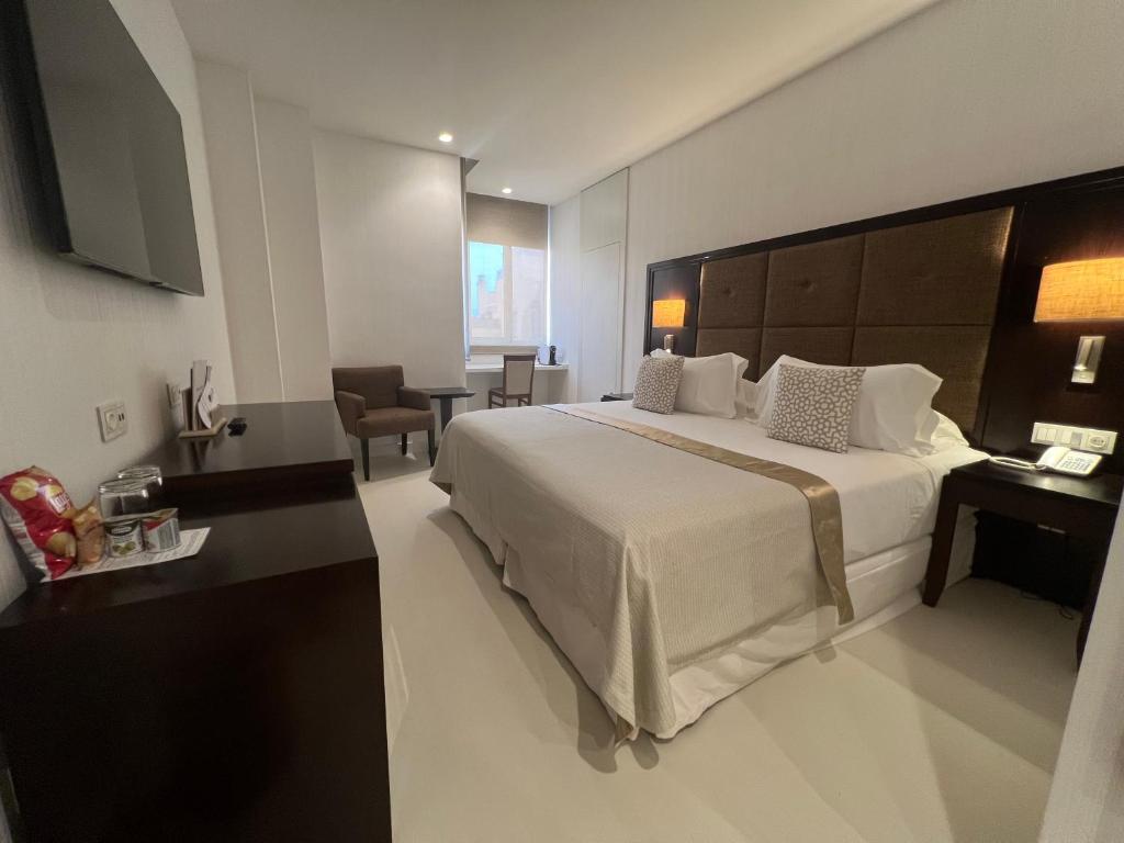 Postel nebo postele na pokoji v ubytování Hotel Saray