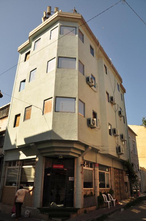 a tall building on the corner of a street at Lotus Hotel in Istanbul