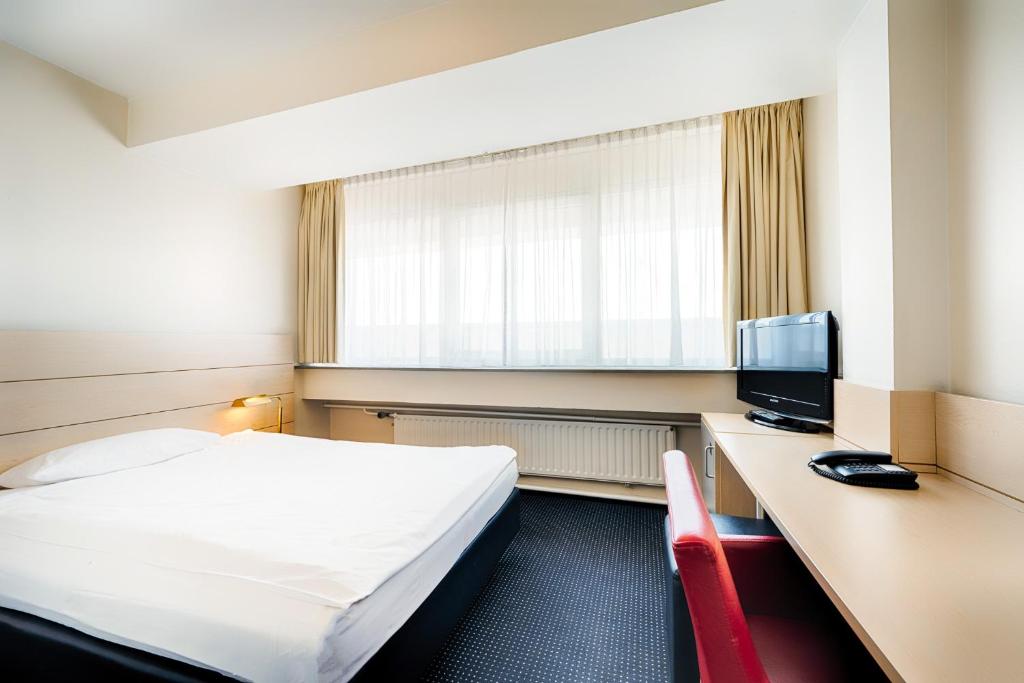 Postel nebo postele na pokoji v ubytování Enjoy Hotel am Studio