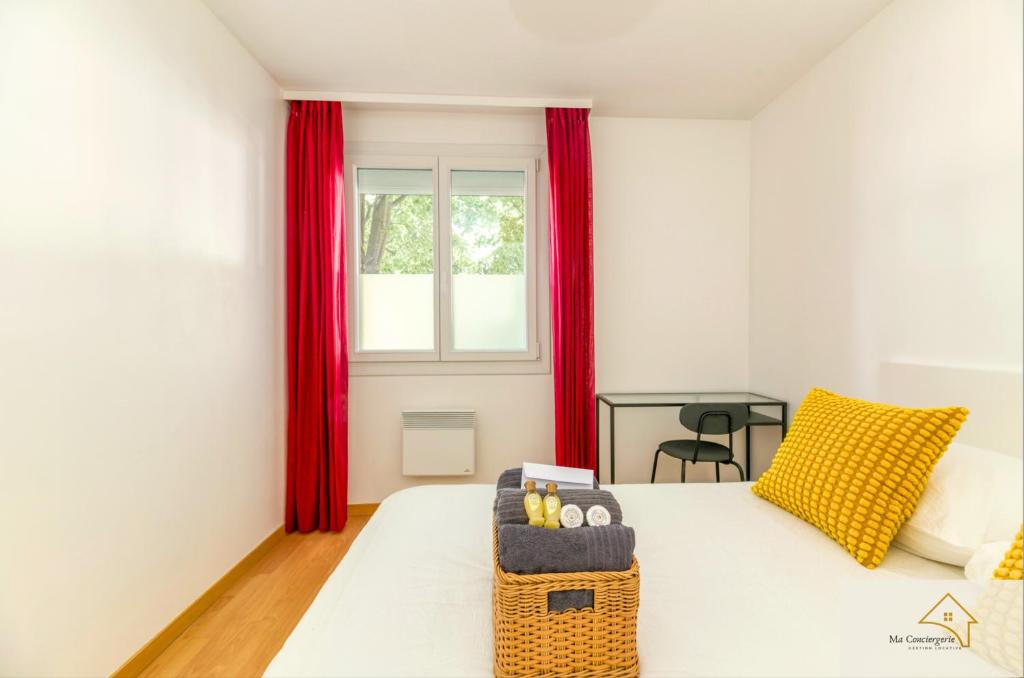 a bedroom with a white bed with red curtains at Le Mykonos¶ Gare¶ 2Garages ¶Jardin ¶Spacieux in Grenoble