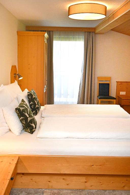 Postel nebo postele na pokoji v ubytování Pension Eichenheim