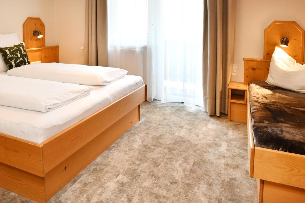 Postel nebo postele na pokoji v ubytování Pension Eichenheim