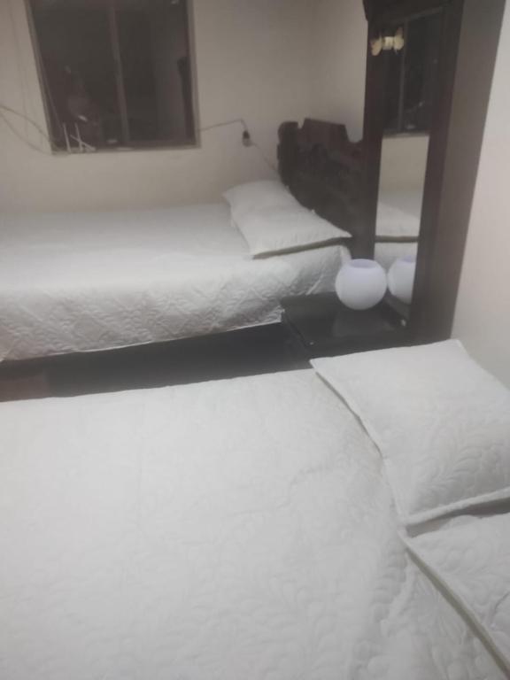 Postel nebo postele na pokoji v ubytování Noras Homestay Laureles