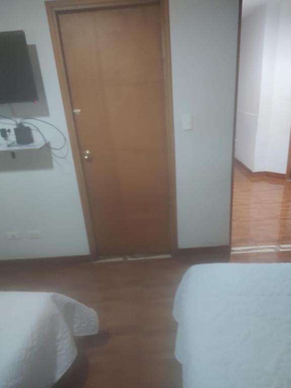 Postel nebo postele na pokoji v ubytování Noras Homestay Laureles