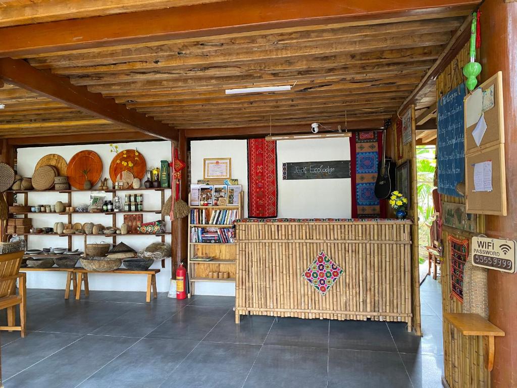 a room with a table and chairs in a store at Jack Ecolodge in Lung Co (1)