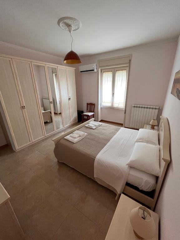 A bed or beds in a room at B&B Kalypso