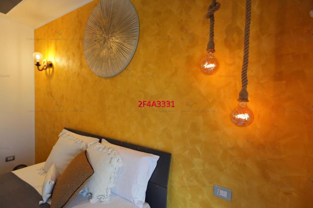 Postel nebo postele na pokoji v ubytování Luxe sur Mer B&B Sorrento