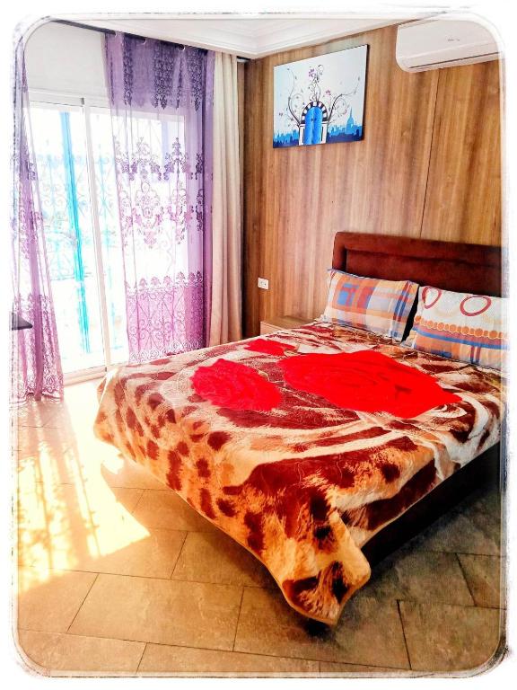 Postel nebo postele na pokoji v ubytování Cosy Duplex" Sidi Bou Said "