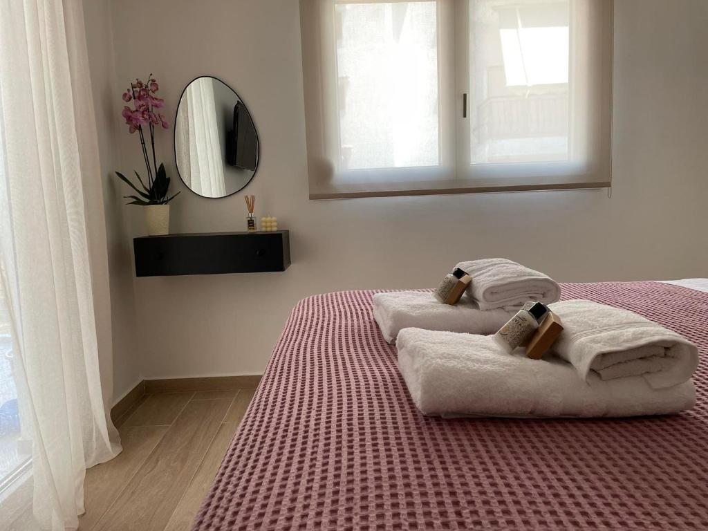 Postel nebo postele na pokoji v ubytování Morpheus boutique apartment