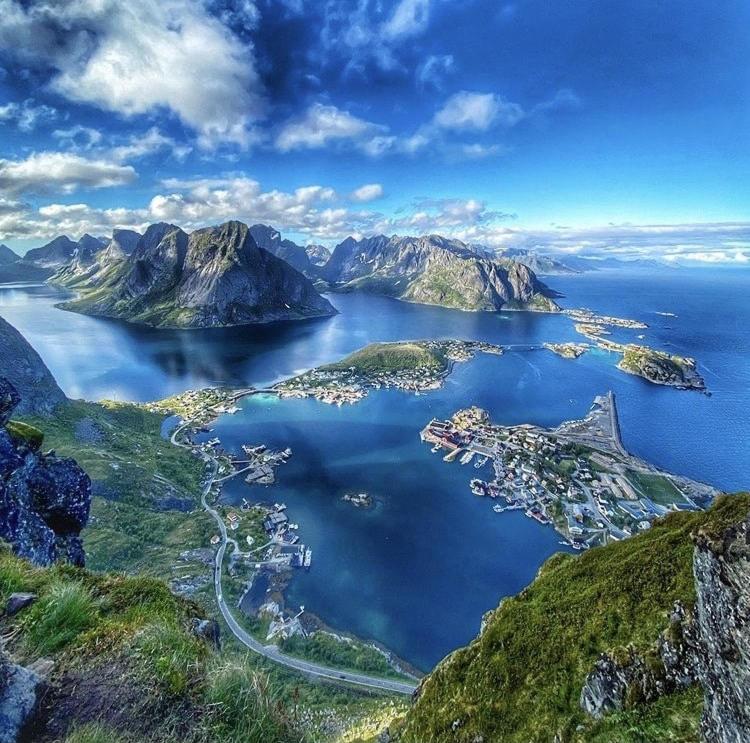 an aerial view of a island in a body of water at House in the heart of Lofoten with spectacular view in Reine