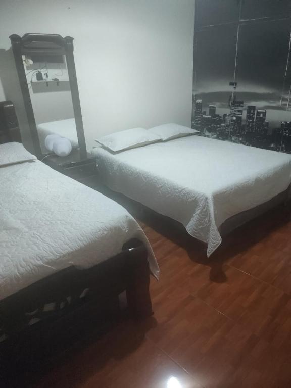 Postel nebo postele na pokoji v ubytování Noras Homestay Laureles