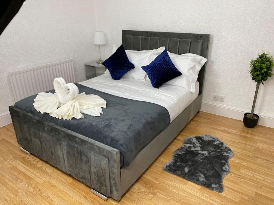 Кровать или кровати в номере House in Medway