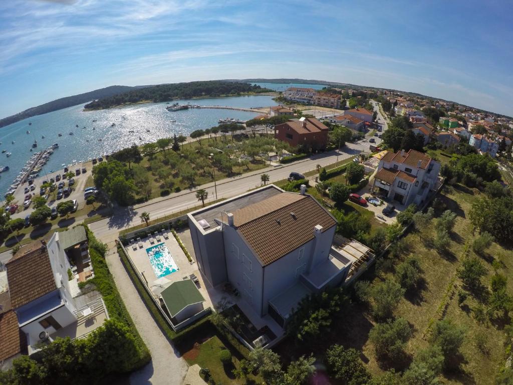 an aerial view of a building next to a body of water at Apartment Lux More in Medulin