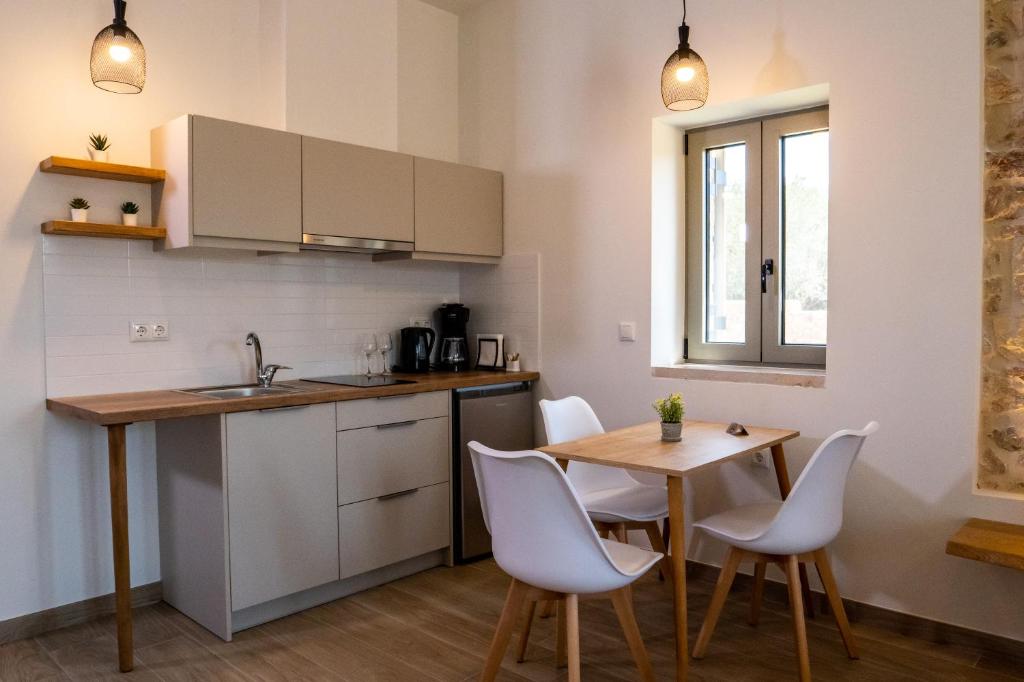 Kuchyň nebo kuchyňský kout v ubytování Olivar Suites