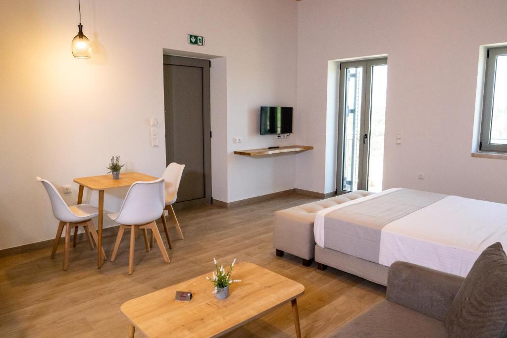 Postel nebo postele na pokoji v ubytování Olivar Suites