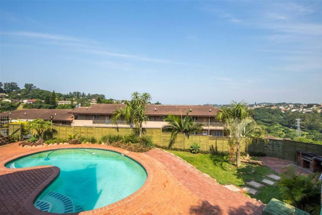 an overhead view of a swimming pool in front of a house at Oliphant luxurious in Durban