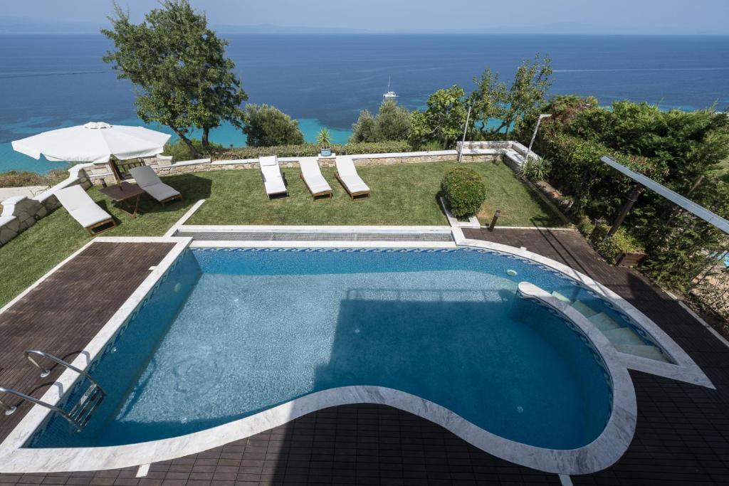a swimming pool with a view of the ocean at Afytos Wonder View by Luxlikehome in Afitos