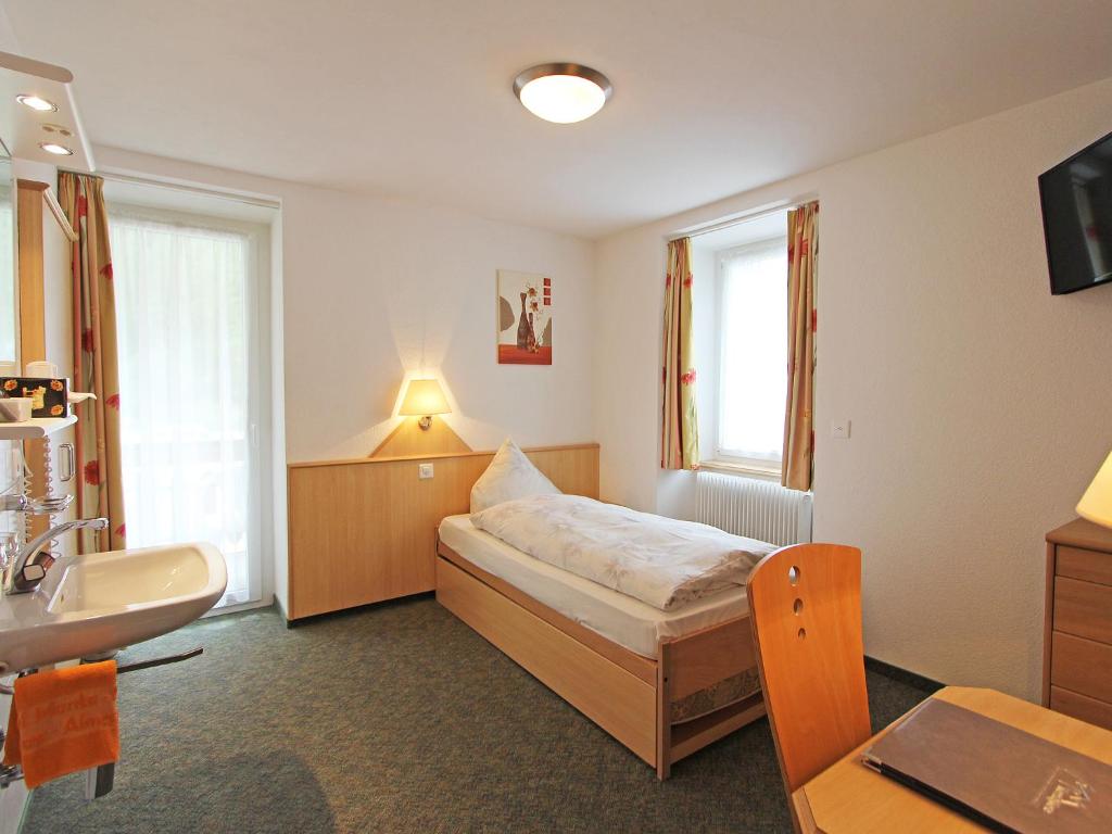 Postel nebo postele na pokoji v ubytování Hotel Monte-Moro