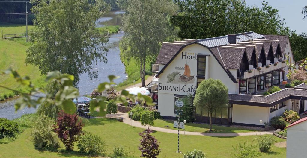 arial view of a hotel with a swamp cafe at Hotel Strand-Café in Roßbach