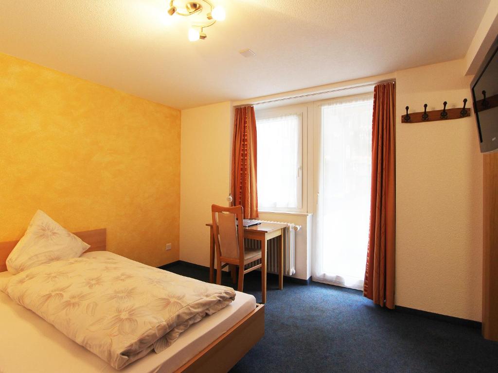 Postel nebo postele na pokoji v ubytování Hotel Monte-Moro