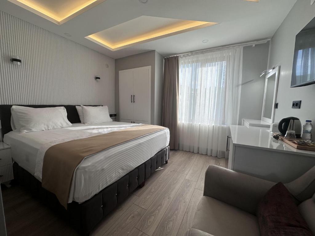 Кровать или кровати в номере Beyaz Köşk Hotel & Cafe