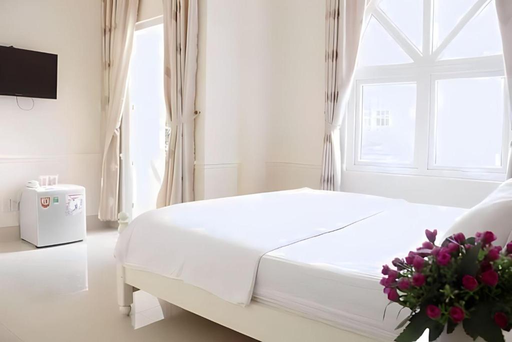 Postel nebo postele na pokoji v ubytování THIÊN ANH HOTEL