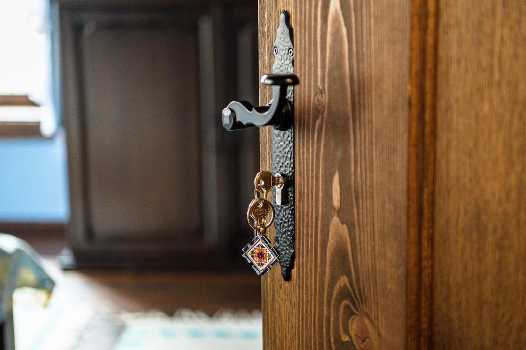 a door with a key on a wooden door at Къща ЕТНО in Koprivshtitsa