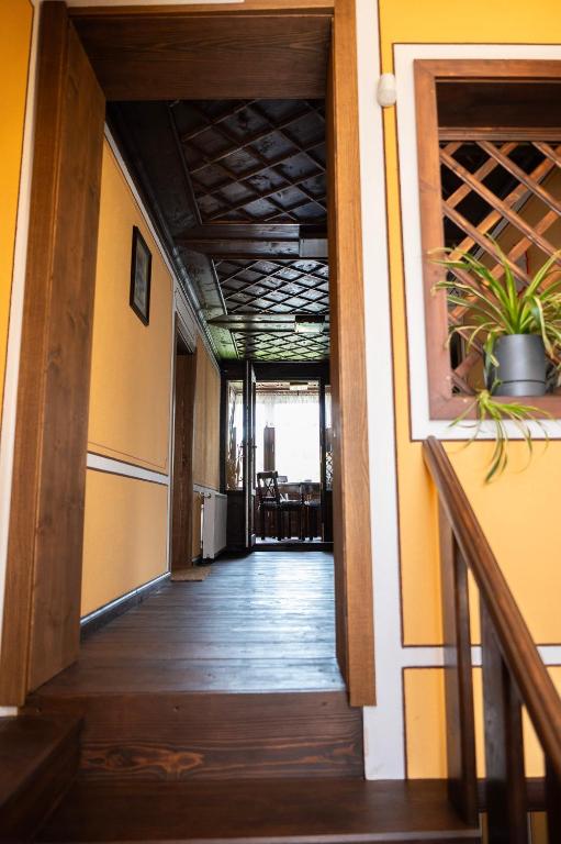 a hallway of a house with a wooden floor at Къща ЕТНО in Koprivshtitsa