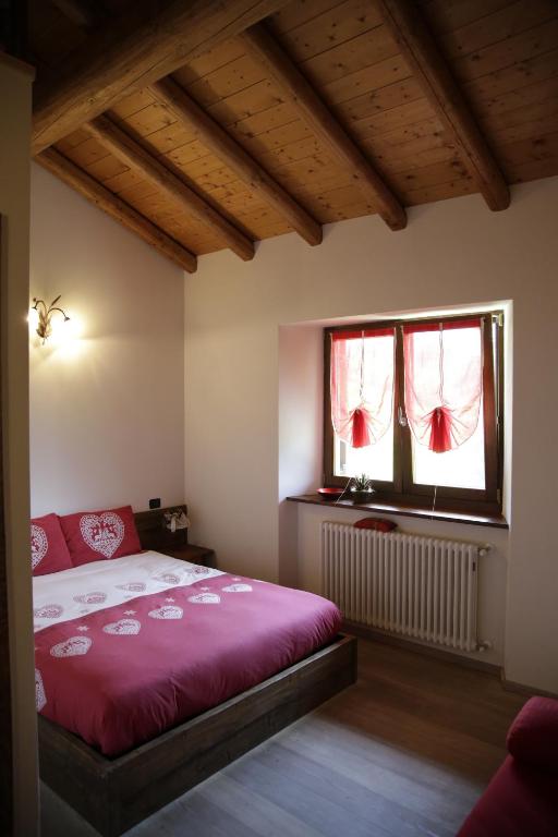 Postel nebo postele na pokoji v ubytování Agriturismo Le Radici