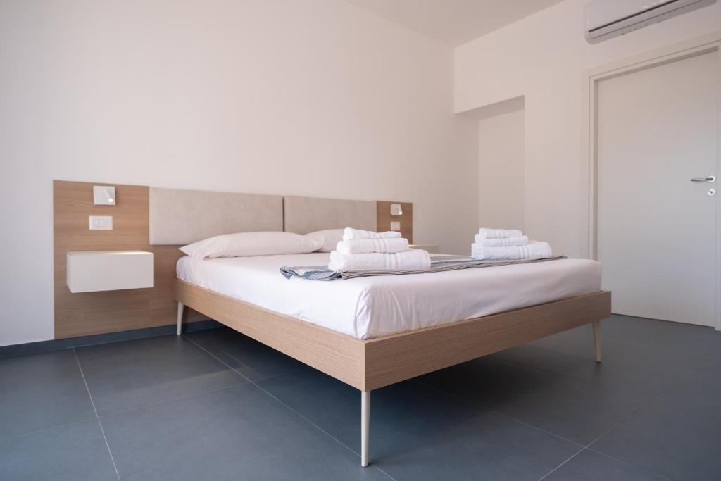 Postel nebo postele na pokoji v ubytování Nautika Suites