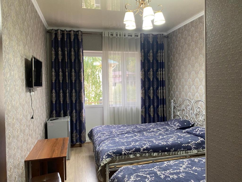 Postel nebo postele na pokoji v ubytování Asem Guest House