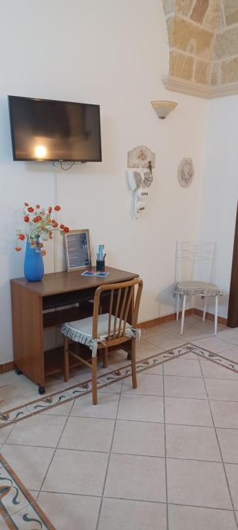 Televízia a/alebo spoločenská miestnosť v ubytovaní Casa Naida