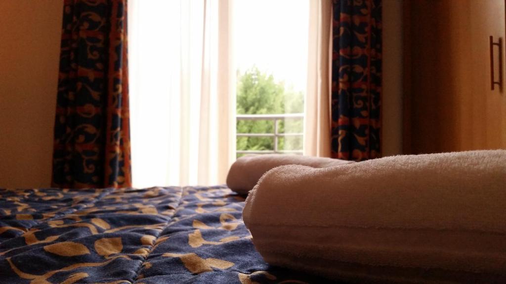 Łóżko lub łóżka w pokoju w obiekcie Palace Hotel Due Ponti