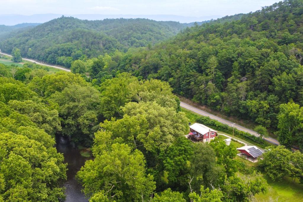 an aerial view of a river and trees at Eagle Rock Cottage Cozy Creekside Getaway with Deck in Eagle Rock