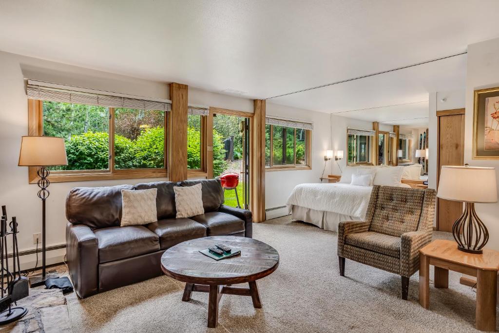 a living room with a couch and a bed at Laurelwood Condominiums 302 in Snowmass Village
