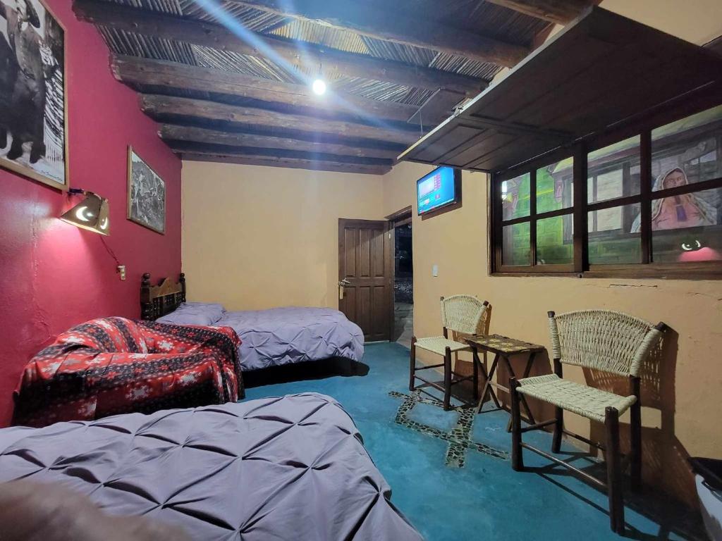 Postel nebo postele na pokoji v ubytování HOTEL RINCÓN MAGICO REAL DE CATORCE