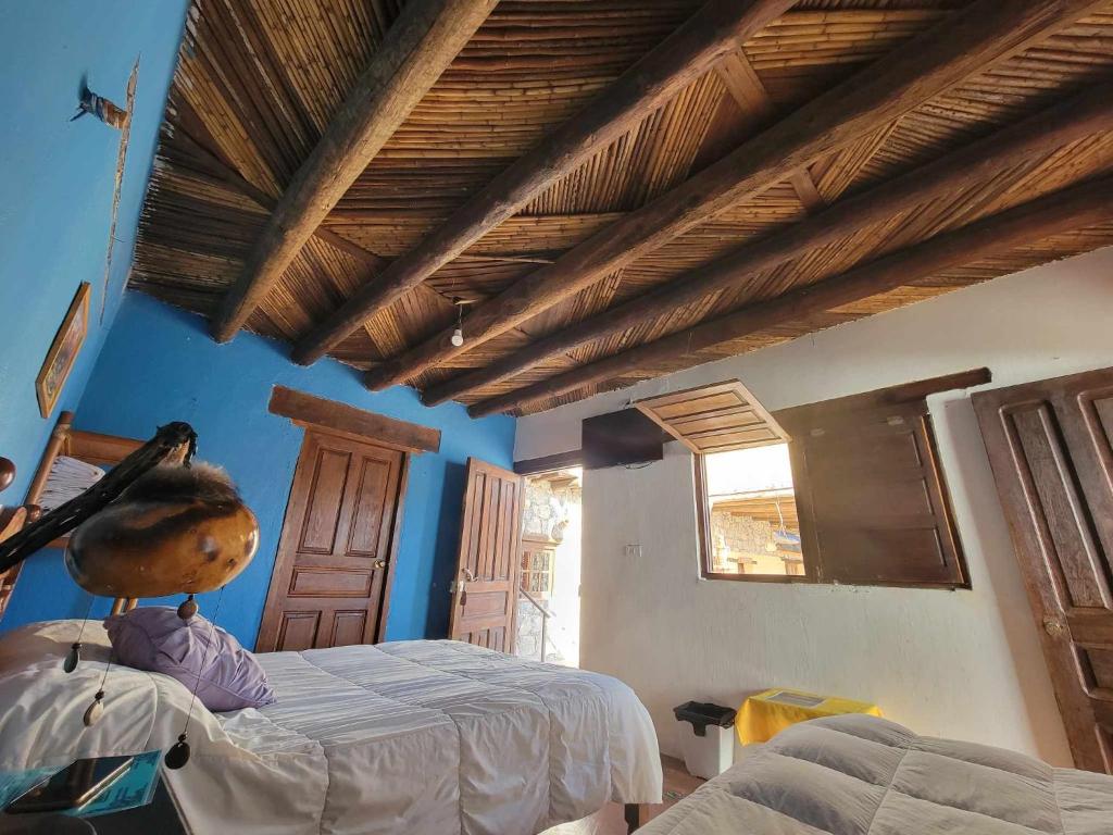Postel nebo postele na pokoji v ubytování HOTEL RINCÓN MAGICO REAL DE CATORCE