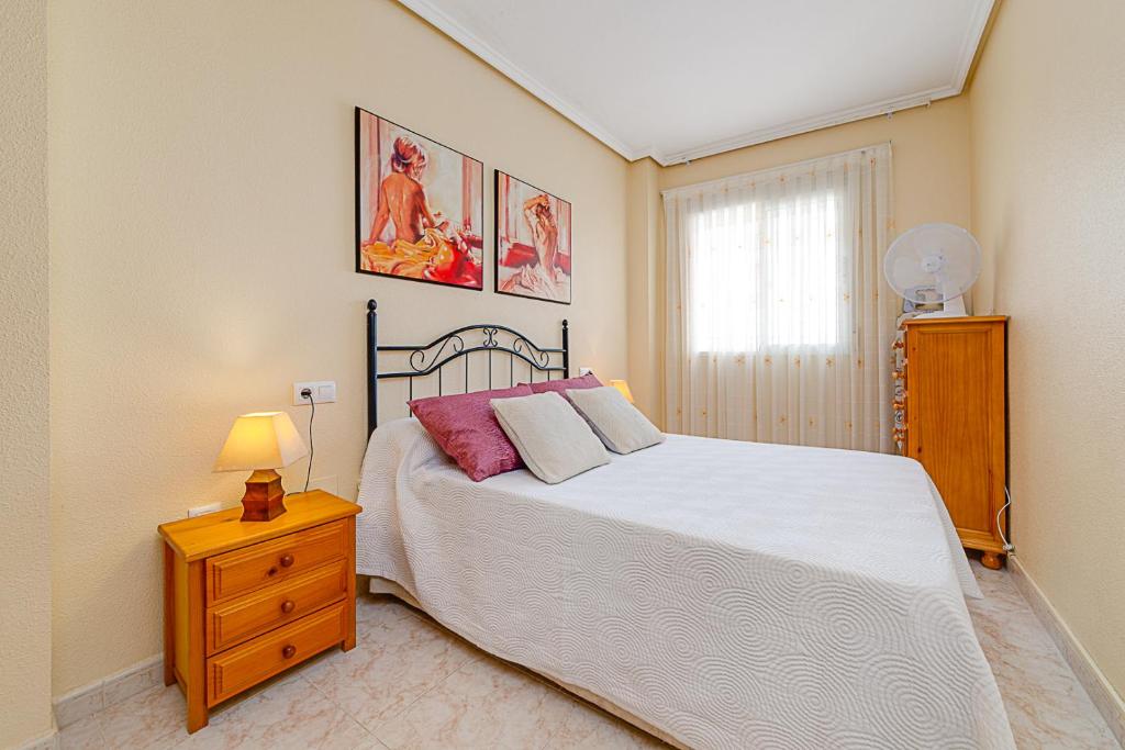 Postel nebo postele na pokoji v ubytování APARTAMENTO MARIA PLAYA DEL CURA