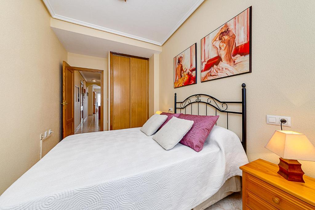 Postel nebo postele na pokoji v ubytování APARTAMENTO MARIA PLAYA DEL CURA