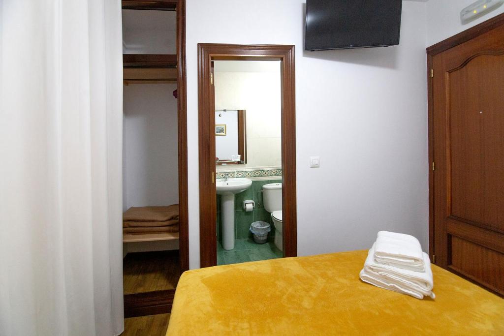 Postel nebo postele na pokoji v ubytování Yani's Hospedaje Pension 1 estrella