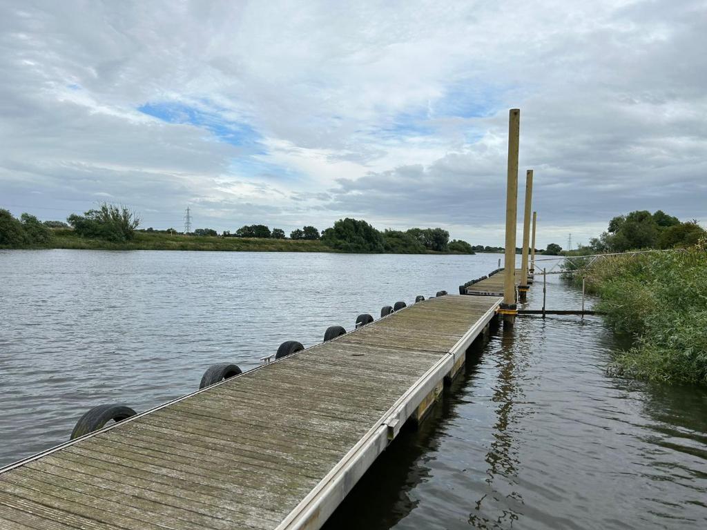 a dock on a body of water at Ralph’s Retreat in Cottam