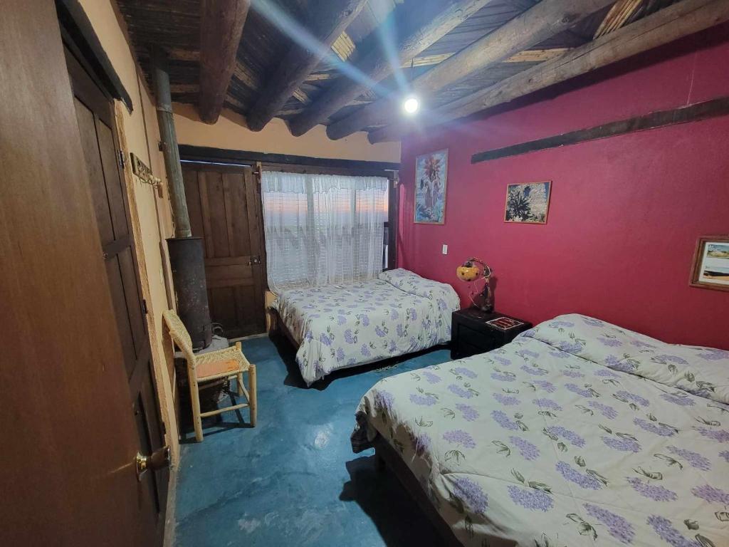 Postel nebo postele na pokoji v ubytování HOTEL RINCÓN MAGICO REAL DE CATORCE