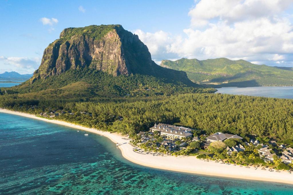 an aerial view of a beach with a mountain at JW Marriott Mauritius Resort in Le Morne